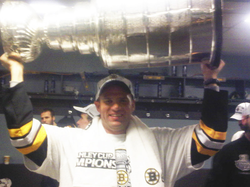 David Weatherbie, a former track and cross country coach at Cape Elizabeth High School who managed to wend his way into the Boston Bruins locker room after Wednesday’s title game, holds aloft the Stanley Cup. “It was surreal, an incredible experience and one I will never forget,” he said.