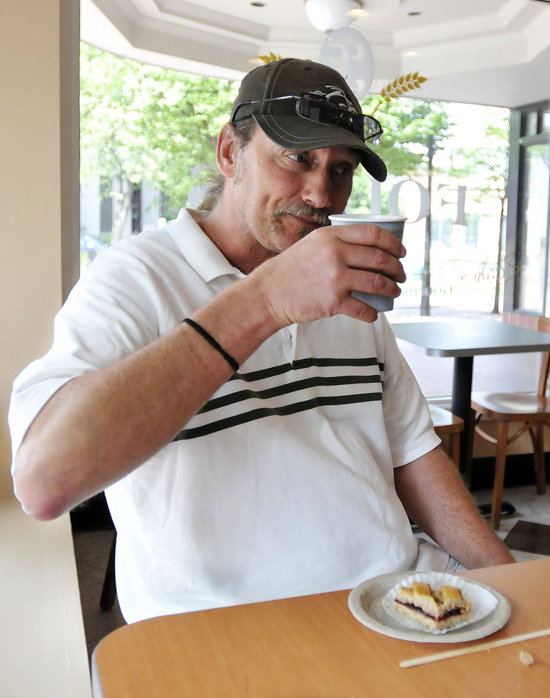 Pete Land, a former coworker of Ed Foley’s, enjoys coffee and pastry at his friend’s establishment.
