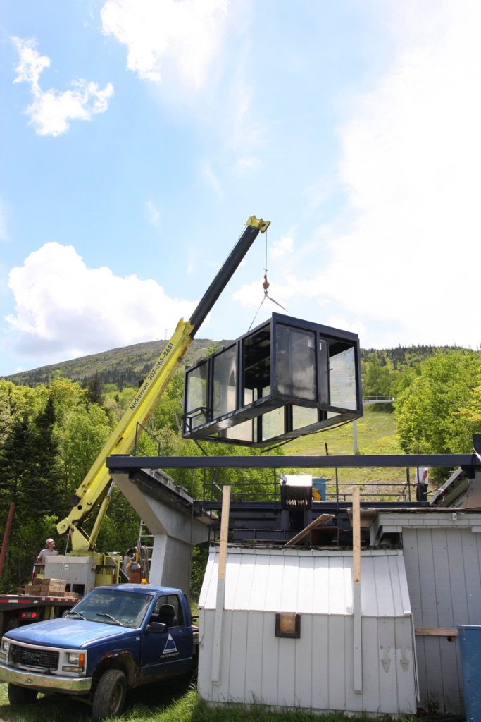 Workers dismantle the Spillway base station at Sugarloaf this month. The Spillway East chairlift, which derailed Dec. 28, will be replaced with a larger lift. Maine's chief tramway inspector did not recommend any enforcement action or changes in the state's oversight process.