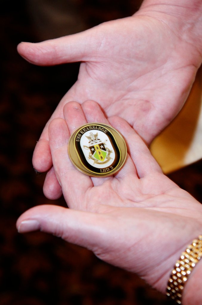 The ship’s coin presented to Sen. Collins came from the USS Kearsarge, which Barnes served on during her time spent in the Navy.