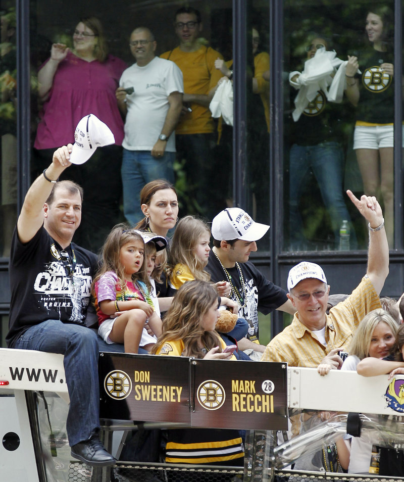 Mark Recchi, left, the oldest player in the NHL this season at age 43, took part in the celebration along with his family. Recchi is retiring after winning the Stanley Cup for the third time in his career.