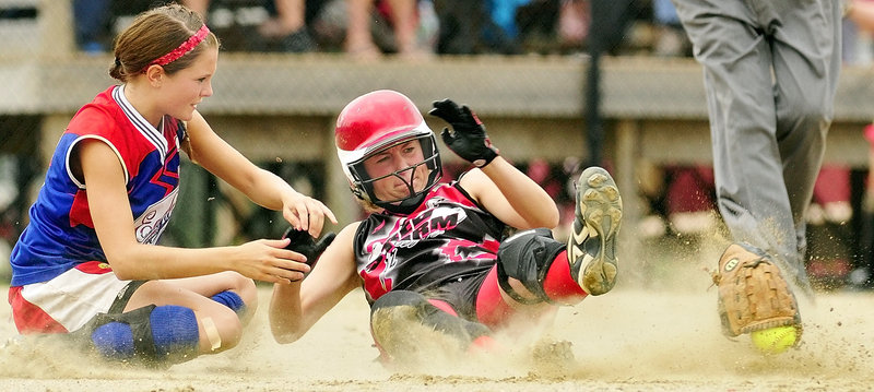 Abby Rutt of Scarborough is safe at second after her slide ripped the ball and glove from second baseman Alei Collier of Messalonskee during the Class A state final at Augusta.