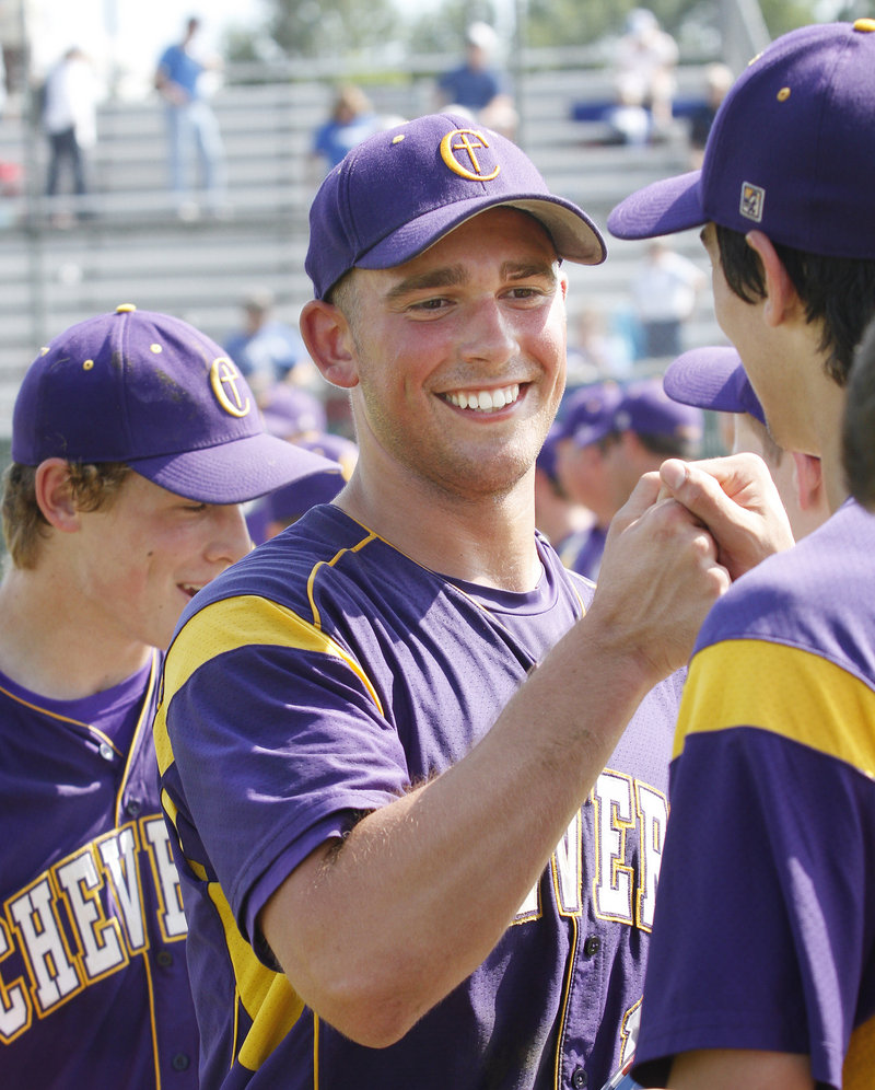 Joey Royer gets cheers from his teammates after pitching a complete game in Cheverus’ Class A baseball state championship victory, 9-1, over Lewiston at Morton Field in Augusta on Saturday.
