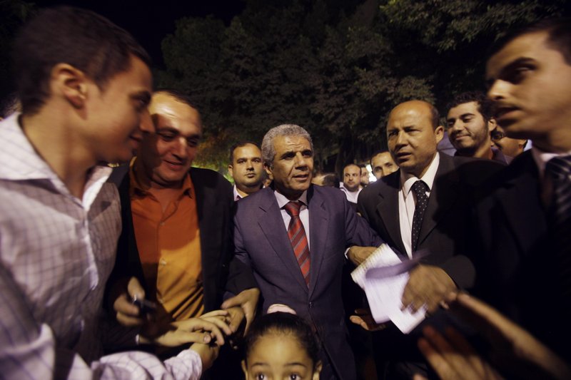 Sobhi Saleh, center, a senior member of the Muslim Brotherhood and former member of parliament, is surrounded by supporters in May in Cairo, Egypt.