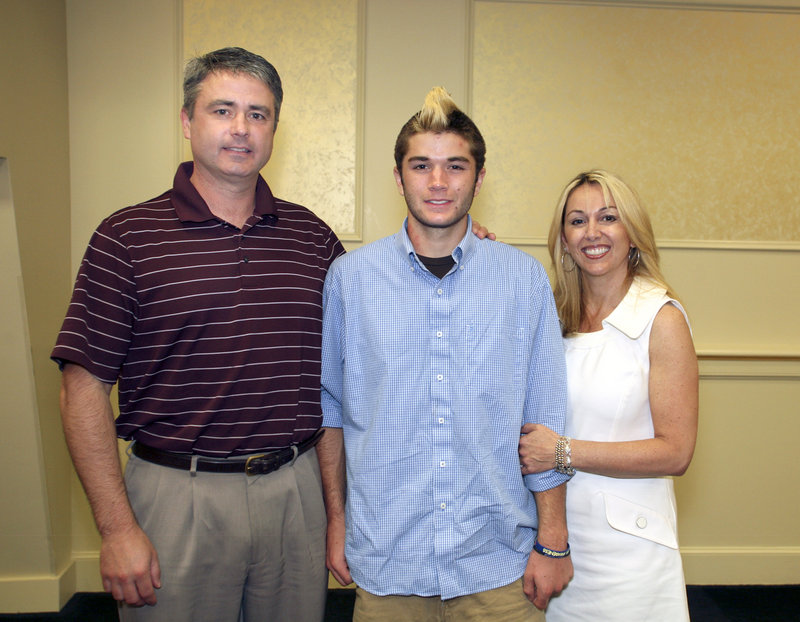 Mitch Tapley, the boys' lacrosse MVP from Falmouth, poses with his parents, Joe and Christina.