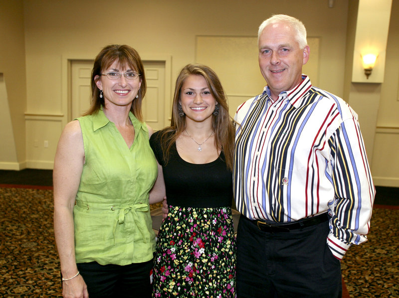 Nicole Kirk, the girls' indoor track MVP from Scarborough, with her parents, Carolyn and Jeff.