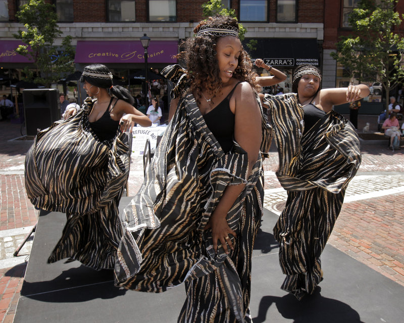 From left, Florence Namuhoranye, Marie Josee Musabyemaiya and Yvonne Karuta, dancers with Umoco Group, a Rwandan cultural group based in Portland, perform in Monument Square in Portland on Monday as part of a celebration marking World Refugee Day, which was started in 2001 by the United Nations High Commissioner for Refugees. In addition to the noon celebration, there was free food from Stareast Cafe and a film at Portland Public Library in the evening.
