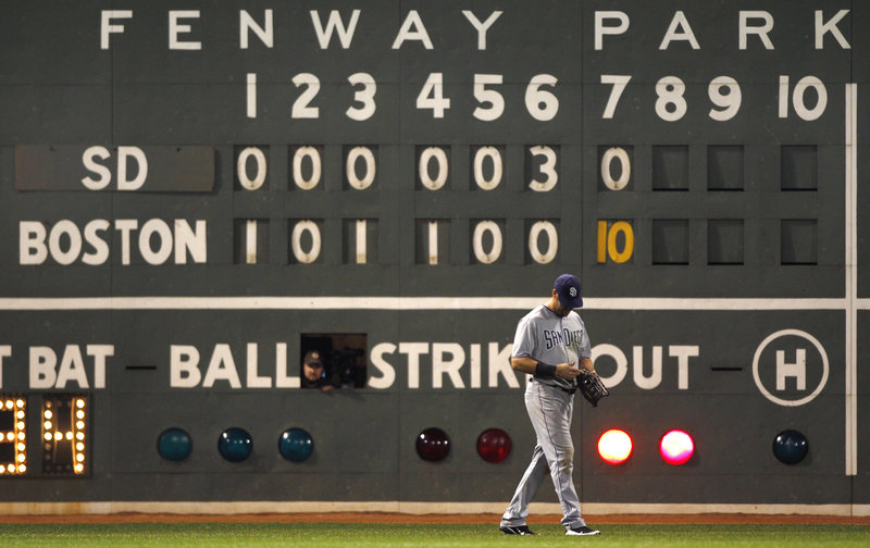 The scoreboard operator enjoys the Fenway Park view during the 10-run inning. San Diego left fielder Ryan Ludwick? Not so much. The Red Sox have won 14 of their last 16 games.