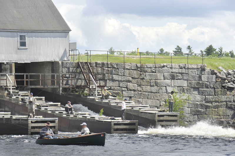 Fishermen cast from the 160-year-old Upper Dam while others work the pool by boat or wading.