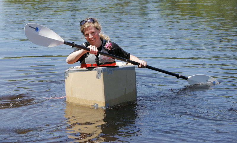 Shannon Bryan, who does not have a degree in naval architecture, test-drives a cardboard boat design.