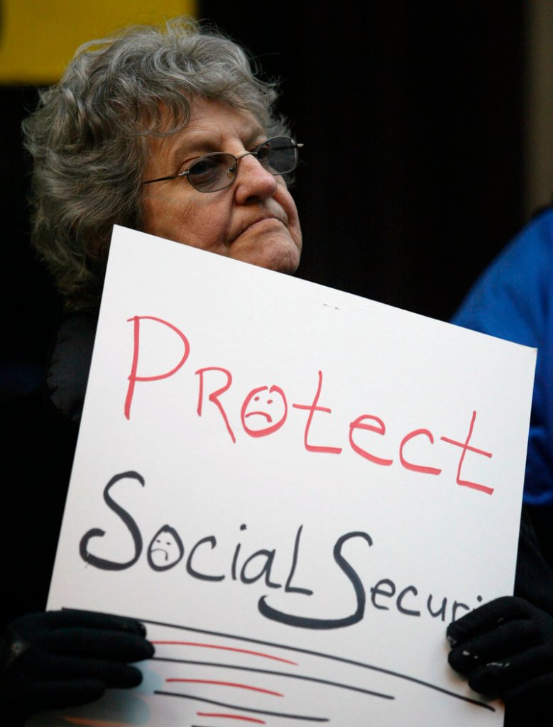An opponent of changes to Social Security demonstrates at a National Council on Aging meeting in Philadelphia in 2005.