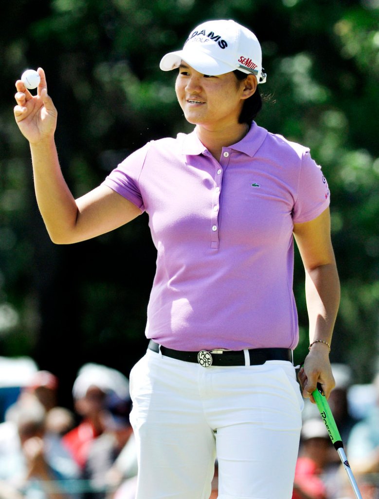 Yani Tseng reacts to the gallery at the ninth hole after sinking a birdie putt Thursday on the way to a 6-under 66, good for the first-round lead in the LPGA Championship.