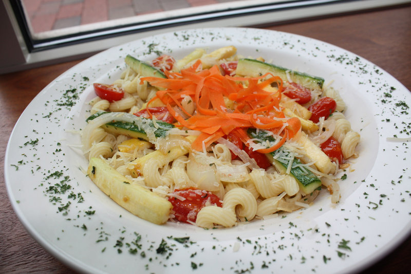 Sebago Brewing Co.'s pasta primavera features garlic, summer squash, zucchini, onions, cherry tomatoes, baby spinach, carrots and shredded Parmesan cheese.