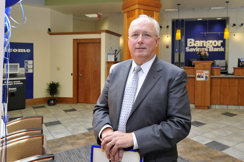 Bangor Savings Bank CEO James Conlon stands in the lobby of the new Falmouth branch.