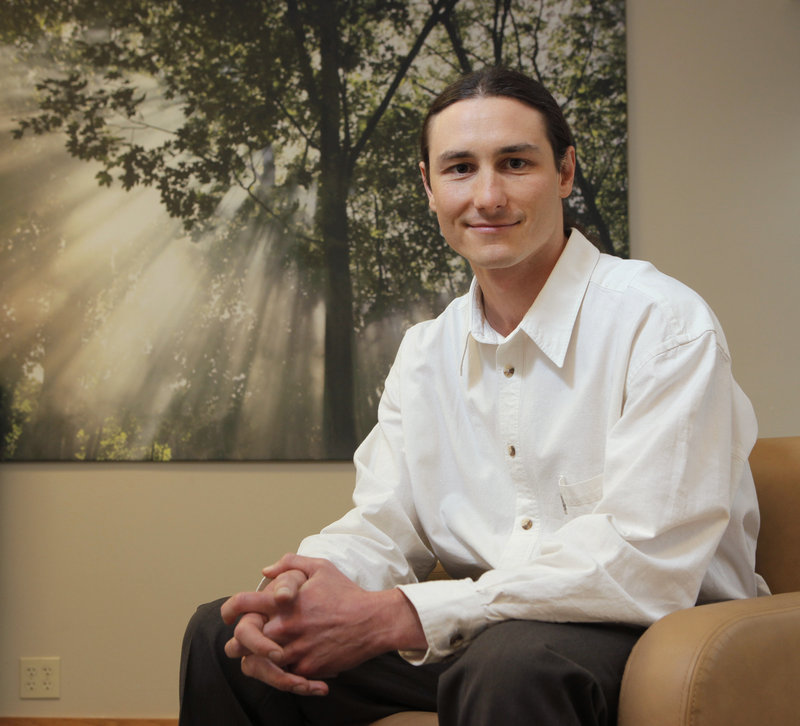 Dr. Dustin Sulak, shown in his Falmouth office, typically recommends treatments beyond cannabis, including vitamin D, turmeric or milk thistle supplements.