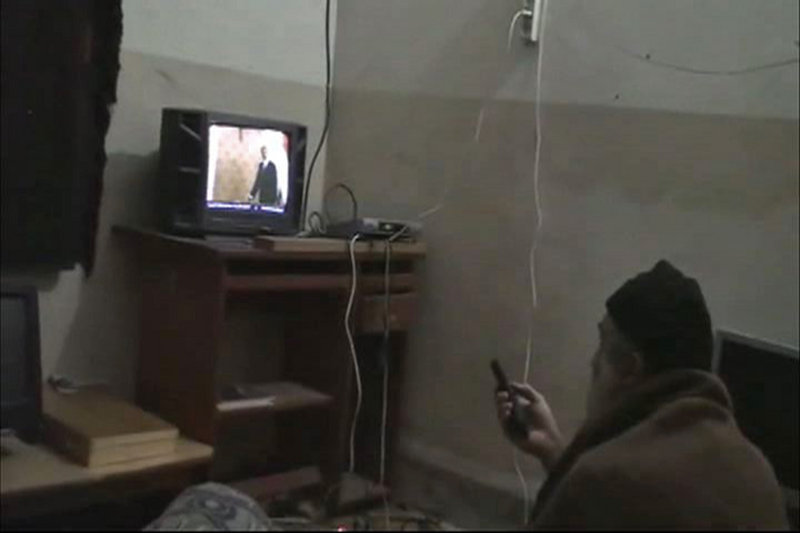 Osama bin Laden watches President Obama on television in this image from a video seized from the compound in Abbottabad, Pakistan. The al-Quaida leader may have escaped detection by leaving as small a footprint as possible.