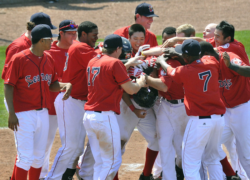 Alex Hassan did something Wednesday he'd never done before: He hit a walk-off home run. And his teammates responded with back-pounding as the Portland Sea Dogs emerged with a 4-3 victory against the New Britain Rock Cats at Hadlock Field.
