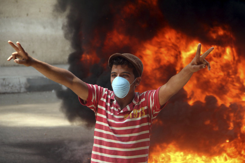 A protester gestures during clashes with security forces in Cairo, Egypt, on Wednesday. The violence in Tahrir Square was the worst since the uprising that ousted Hosni Mubarak.