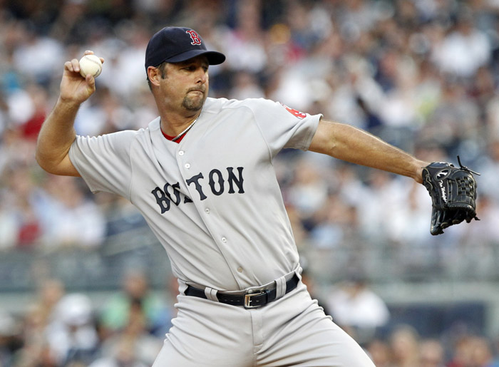 Boston Red Sox's Tim Wakefield delivers a pitch during the first inning of the game Wednesday at Yankee Stadium.