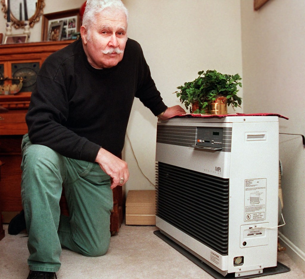 Jim Friedlander shows the Monitor heater that he uses to heat his home in Brunswick. Fuel economy and low installation costs made direct-vent heaters like the Monitor popular in cold-weather climates with high energy prices, including the Northeast, Pacific Northwest and Alaska.