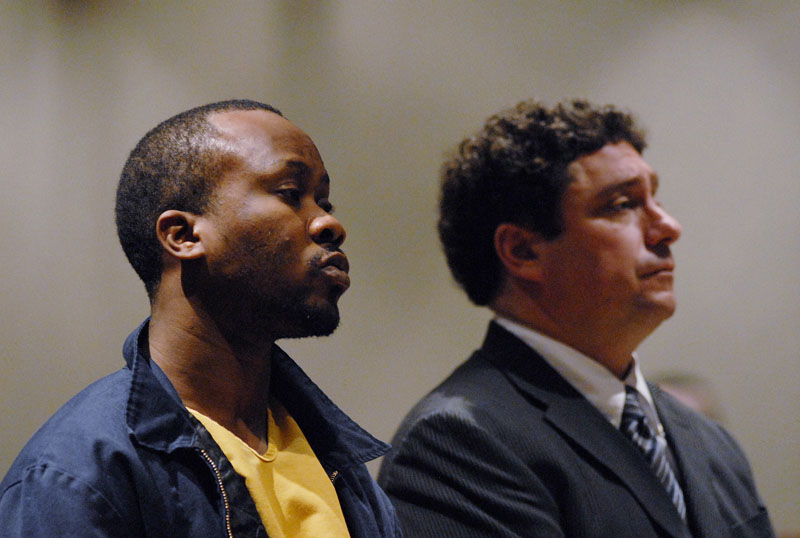Staff Photo by Shawn Patrick Ouellette: Daudoit Butsitsi appears in court with his lawyer Anthony Sineni. Butsitsi is charged with gunning down a 24-year-old Serge Mulongo. Tuesday, Feb 16, 2010.