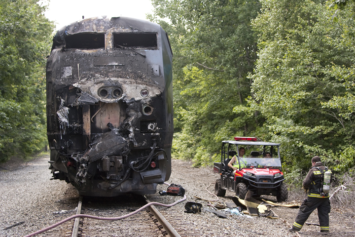 The Downeaster engine's charred remains sit near the collision scene in North Berwick.