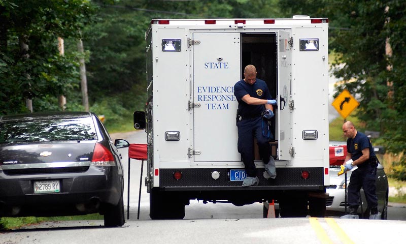 State Police collect evidence at the scene of a double shooting at 322 Bennett Road, New Gloucester Tuesday, July 26, 2011.