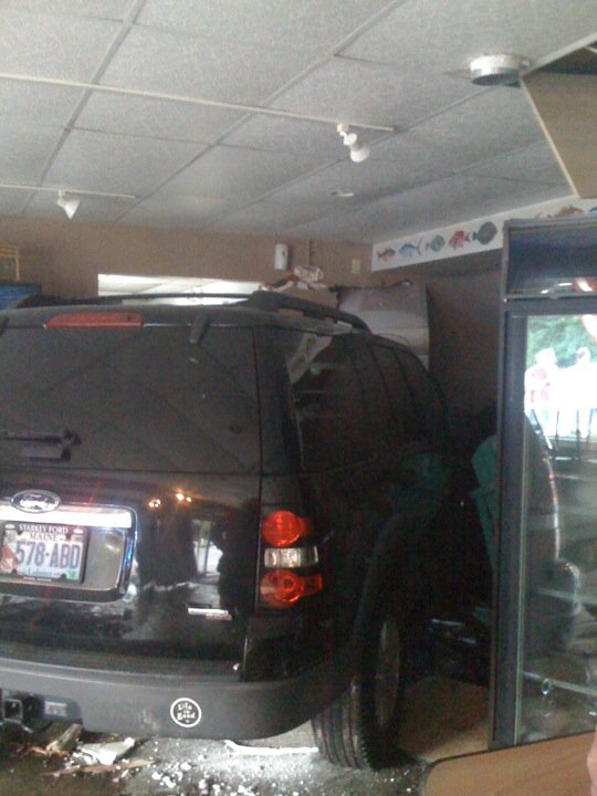 A 2006 Ford Explorer ended up in the bathroom after crashing through the wall at York Lobster & Seafood.