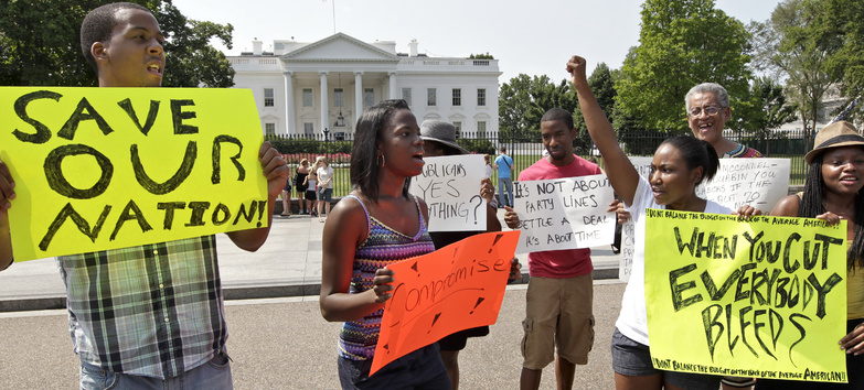 College students march at the White House on Saturday in an appeal to President Obama and congressional leaders to reach a compromise on the debt limit.