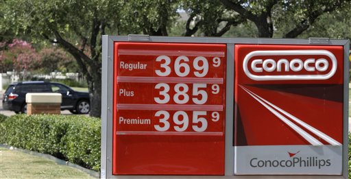 A ConocoPhillips filling station displays this week's prices Thursday in Irving, Texas. A gallon of regular is 33 cents cheaper than its peak price this year, but it is 94.2 cents higher than the same time last year and 7 cents higher than it was just a week ago.