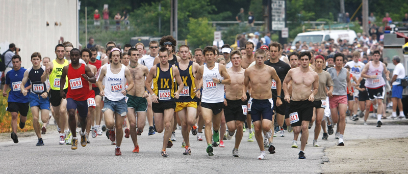 Runners kick off at the start of the 4 on the Fourth road race in Bridgton today.
