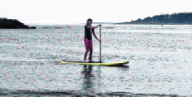 The Almeida 13-year-old applies her newly acquired paddleboarding technique at Kettle Cove in Cape Elizabeth. For balance, it’s best not to let the paddle get too far behind you.