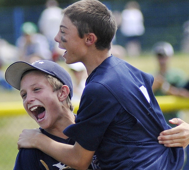 Jack Snyder, left, and Noah Pellerin of Yarmouth celebrate after Yarmouth beat York 6-3 today to win the state Little League championship at Portland's Payson Park.
