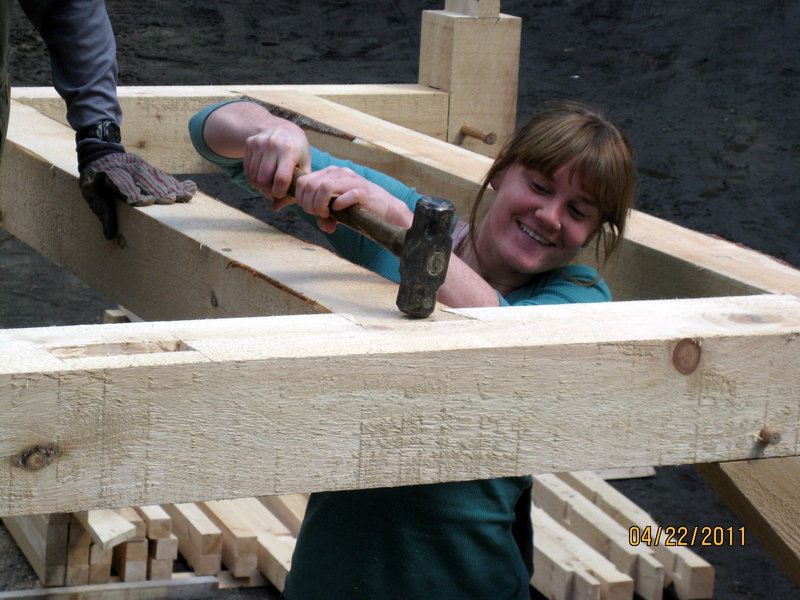 Marnie Briggs of Bath assembles a mortise and tenon joint during a timber-framing class earlier this year. A four-day class will be offered July 16, 17, 23 and 24 at Hidden Valley Nature Center in Jefferson.