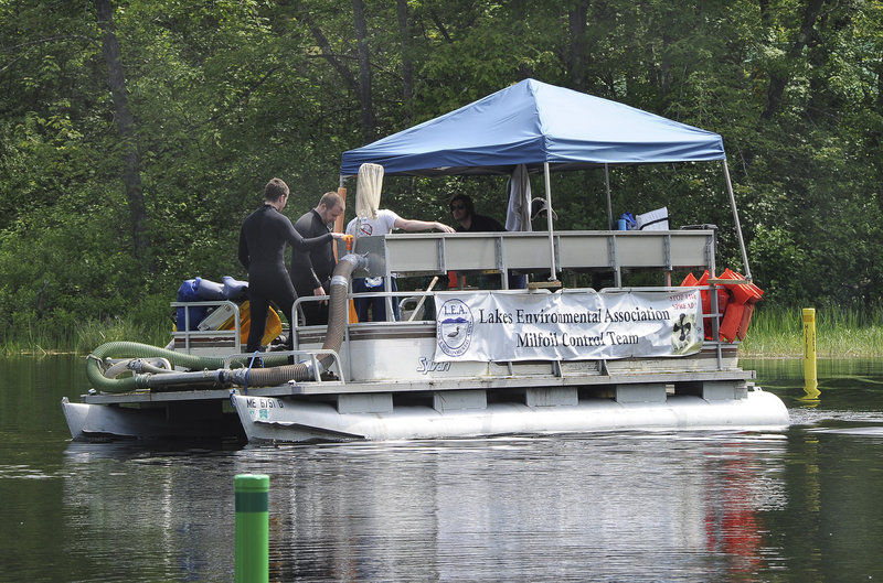 The team from the Lakes Environmental Association is removing milfoil from the Songo River in Naples using the S.S. Libra, a watercraft fitted with a suction and filtration system. Invasive plants have been found in 33 of the state’s 5,700 lakes and ponds.