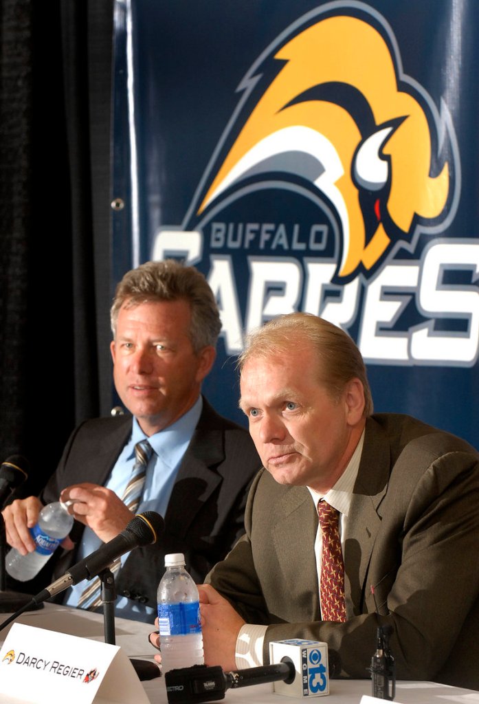 Buffalo Sabres, 2008-2011: Buffalo Managing Partner Larry Quinn, left, and General Manager Darcy Regier announce an affiliation with the Pirates in 2008.