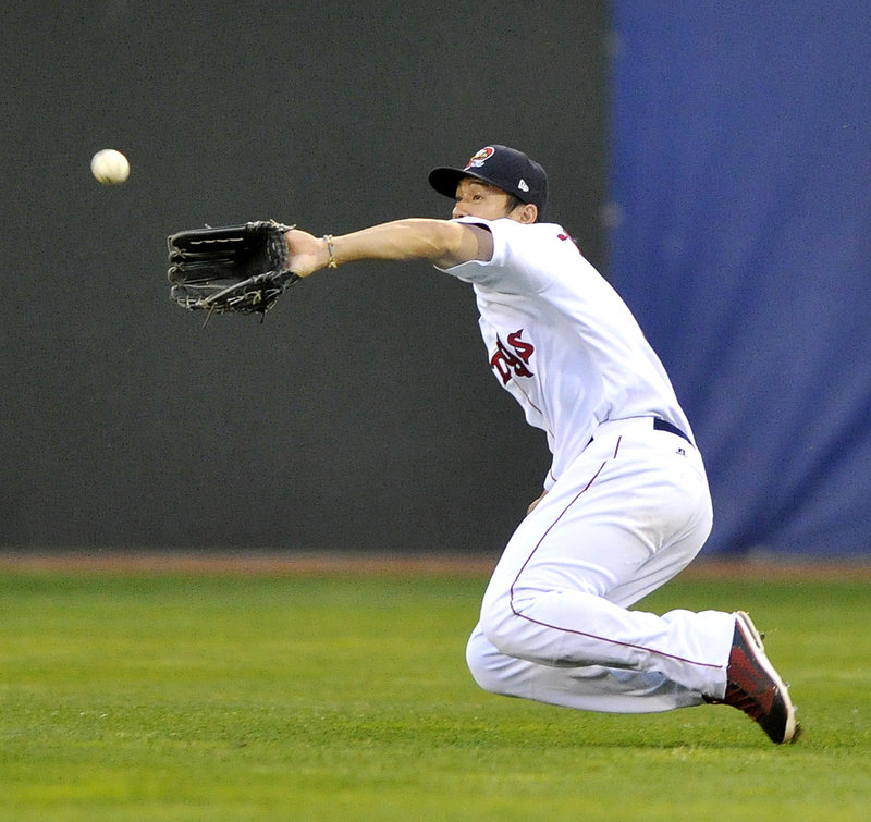 Sea Dogs right fielder Chih-Hsien Chiang makes a sliding catch on a fly ball in a 10-6 win over New Hampshire.