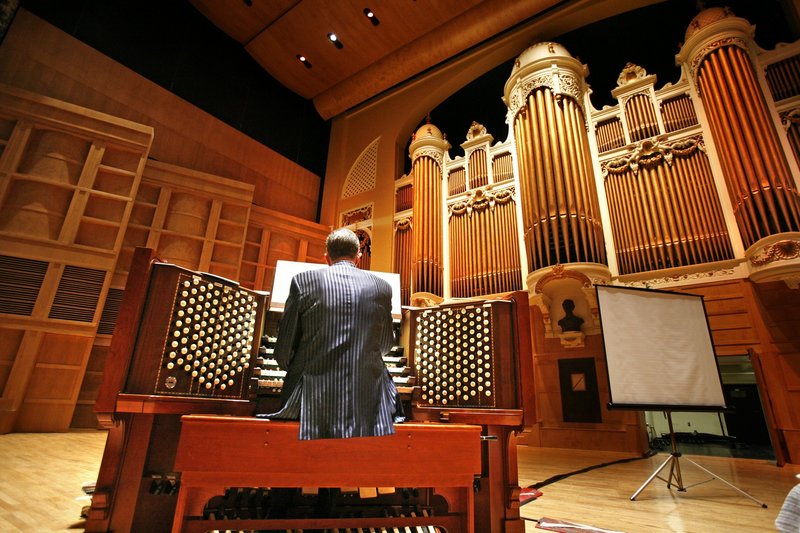Municipal organist Ray Cornils plays the Kotzschmar Organ at Merrill Auditorium in the summer of 2009. The organ, a gift to the city of Portland in 1912, has almost 7,000 pipes.