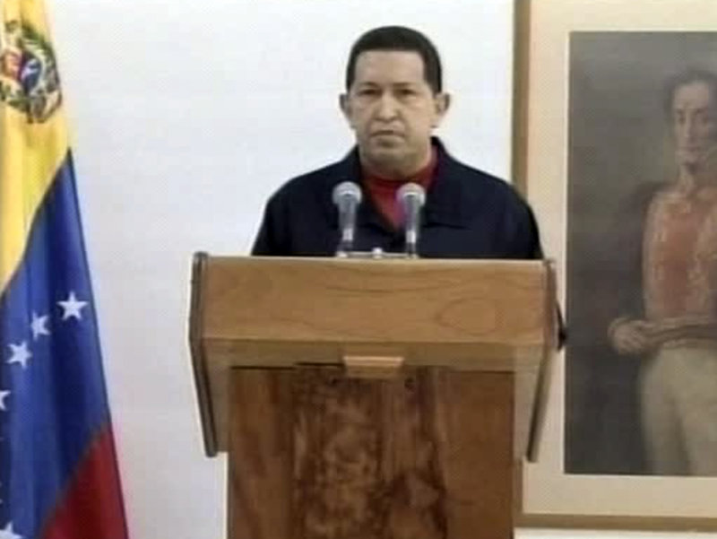 Venezuela President Hugo Chavez appears on Cuban TV Thursday. He said he underwent surgery to remove a cancerous tumor.