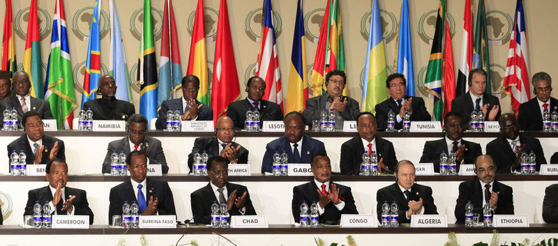 Leaders applaud during the opening session of the 17th African Union Summit outside Malabo, Equatorial Guinea, on Thursday. The AU was divided between those wanting to issue a call for Gadhafi’s departure and those arguing that he is an elected head of state and cannot be forced out.