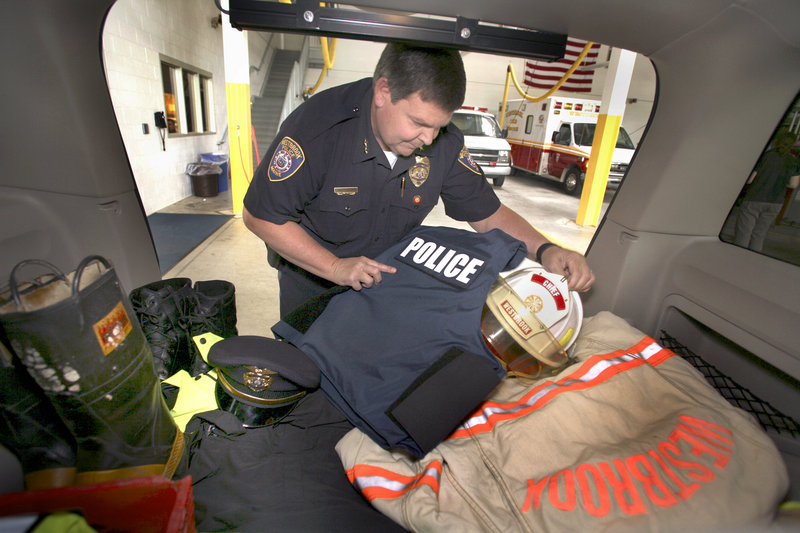 Westbrook Public Safety Director Mike Pardue keeps both his fire and police equipment ready to go in the back of a car at the Public Safety Building.