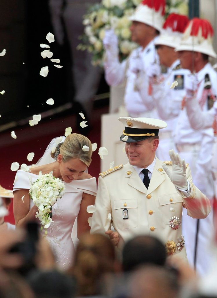 Prince Albert II of Monaco and Princess Charlene leave the Monaco palace after their religious wedding ceremony Saturday.