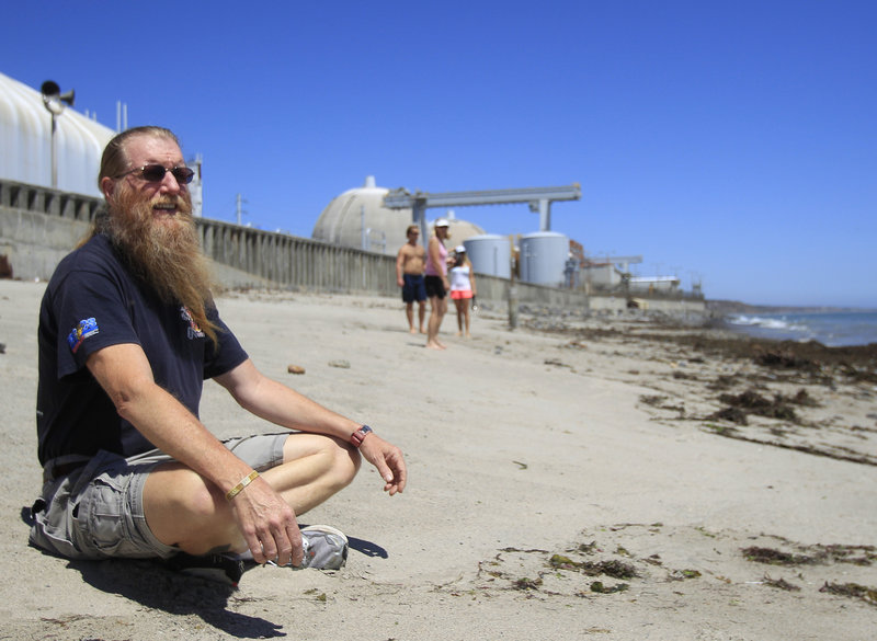 Bret Gross sits on the beach outside the San Onofre nuclear power plant, about five miles from his San Clemente, Calif., home. He worries that the area couldn’t be quickly evacuated in a nuclear accident. “Forget the amount of training and plans,” he said. “It’ll be ugly.”