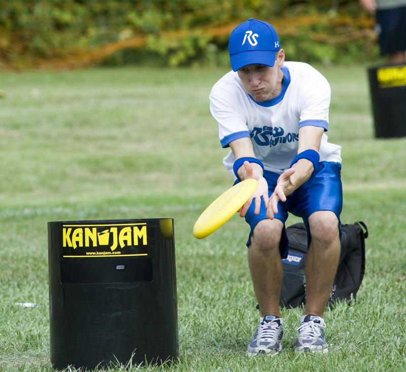 A KanJam player can deflect the disc to help it hit or land in the can. The disc can enter the can at the top or through a slot in its side.