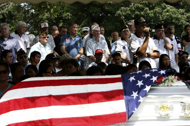 Retired American soldiers attend the burial rites for their comrade Erskine Ralph Milward, a retired Army chief warrant officer, at Clark Veterans Cemetery in the Philippines on Friday.