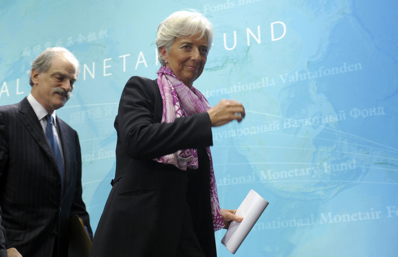 Christine Lagarde, new managing director of the International Monetary Fund, leaves a news conference Wednesday in Washington with John Lipsky, who was acting managing director after the resignation of Dominique Strauss-Kahn.