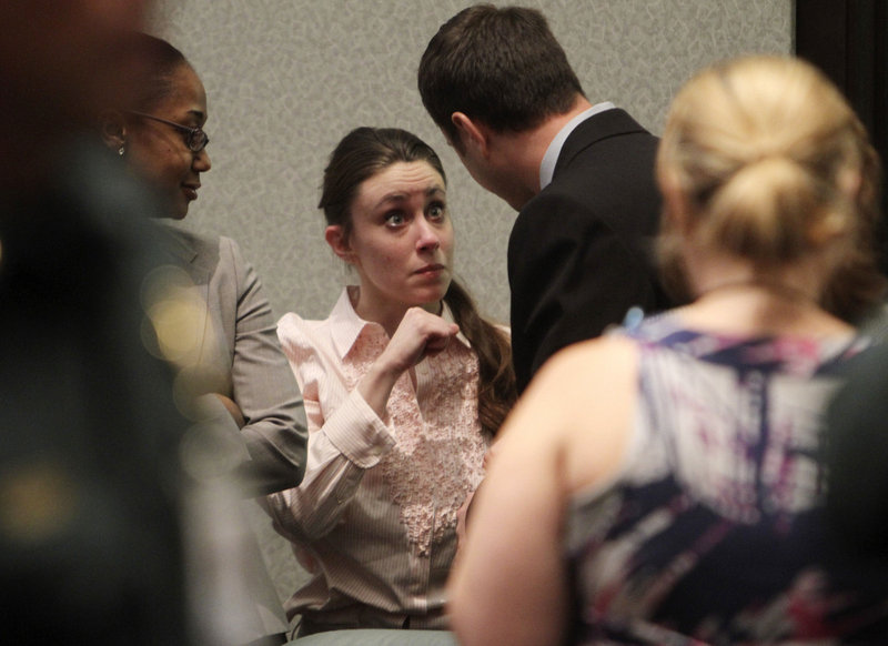 Casey Anthony talks with a supporter Tuesday in Orlando, Fla., after she was acquitted of killing her daughter. She will be sentenced today for lying.
