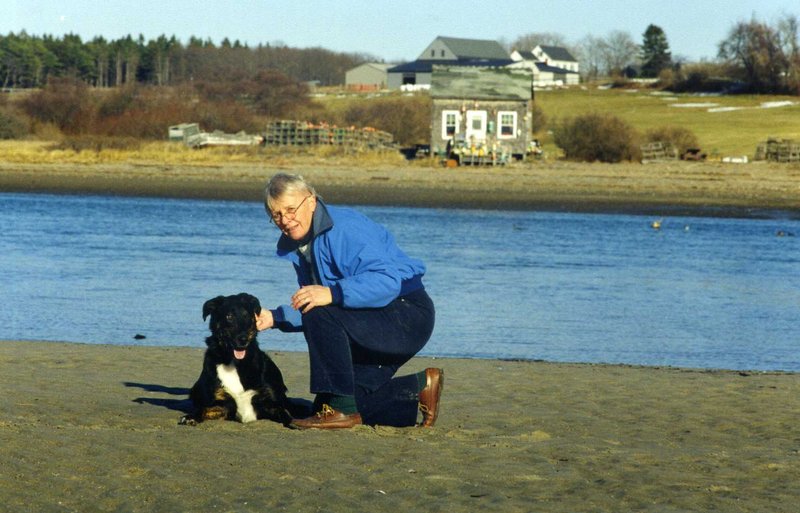 Elaine Barry plays with her dog Rudy on Higgins Beach. After a successful 25-year career as a nurse, Barry graduated from USM and was a teacher for 11 years.