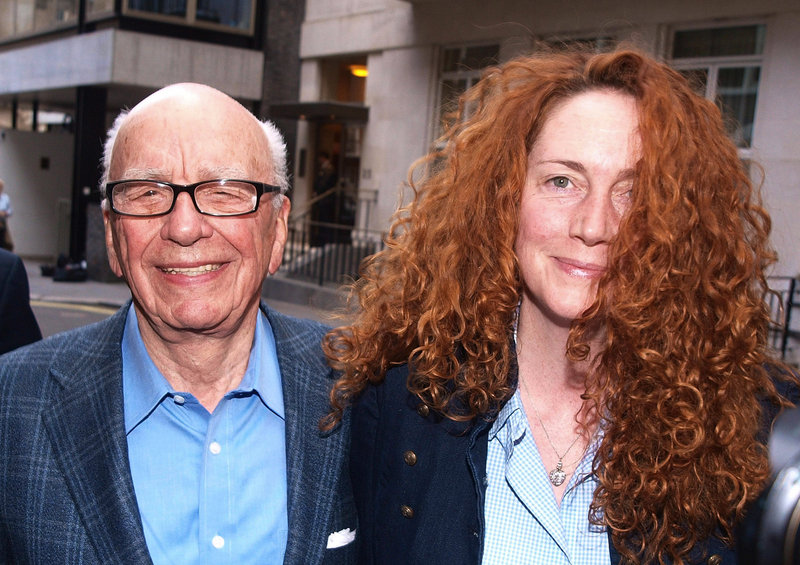 Rupert Murdoch and News International’s chief executive, Rebekah Brooks, leave his apartment after meeting in London on Sunday. Britain’s tabloid News of the World ceased publication with Sunday’s issue.