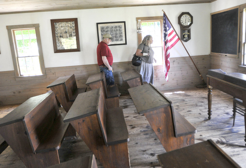 Mike and Karelle Morrissey, of Beverly, Mass., tour the Fenderson School House at 19th Century Willowbrook Village last week. Don King founded the museum to hold his collection of artifacts.